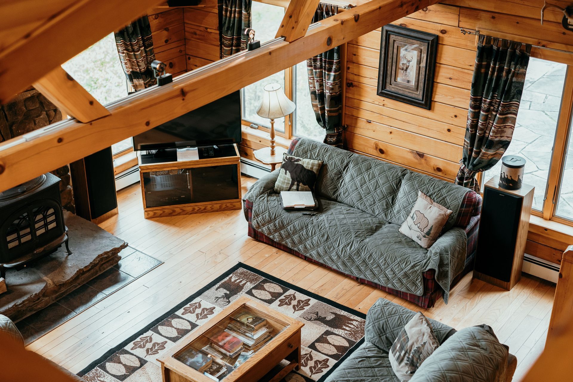An aerial view of a living room in a log cabin.