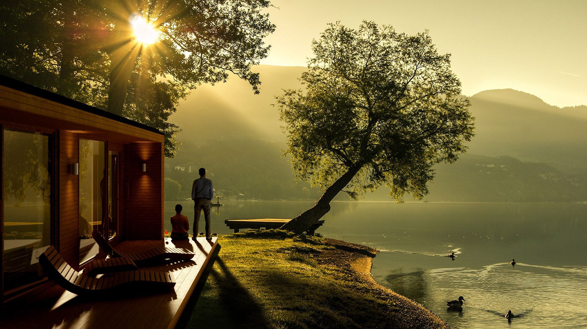 Image of 2 people sat outside a house overviewing a lake