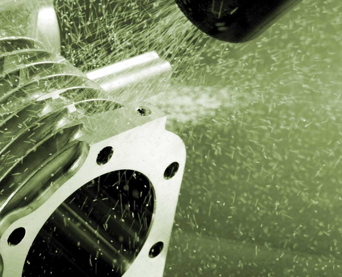 A close up of a machine with a green background
