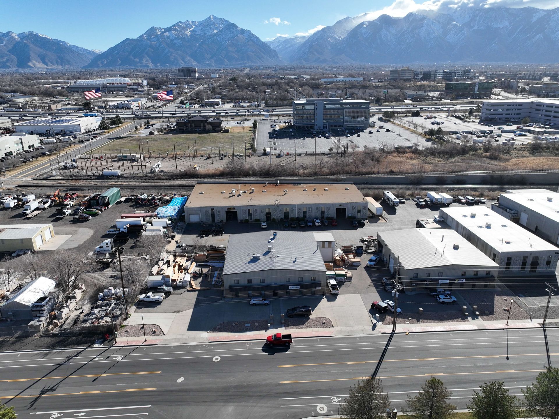 An aerial view of a city with mountains in the background