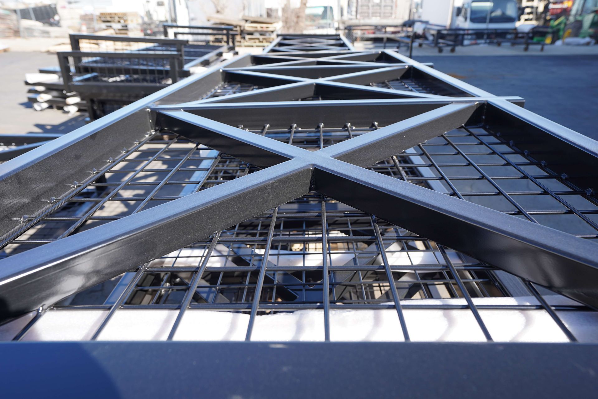 A close up of a metal structure in a parking lot.