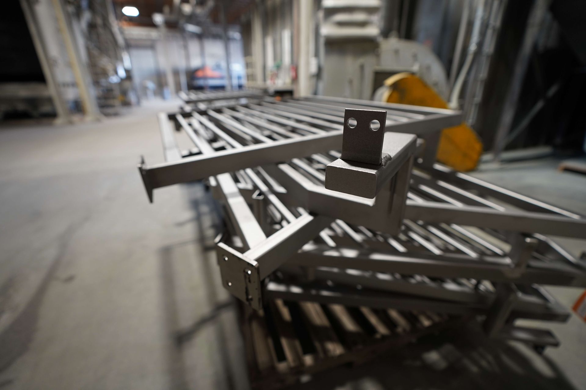 A stack of metal pieces sitting on top of each other in a factory.