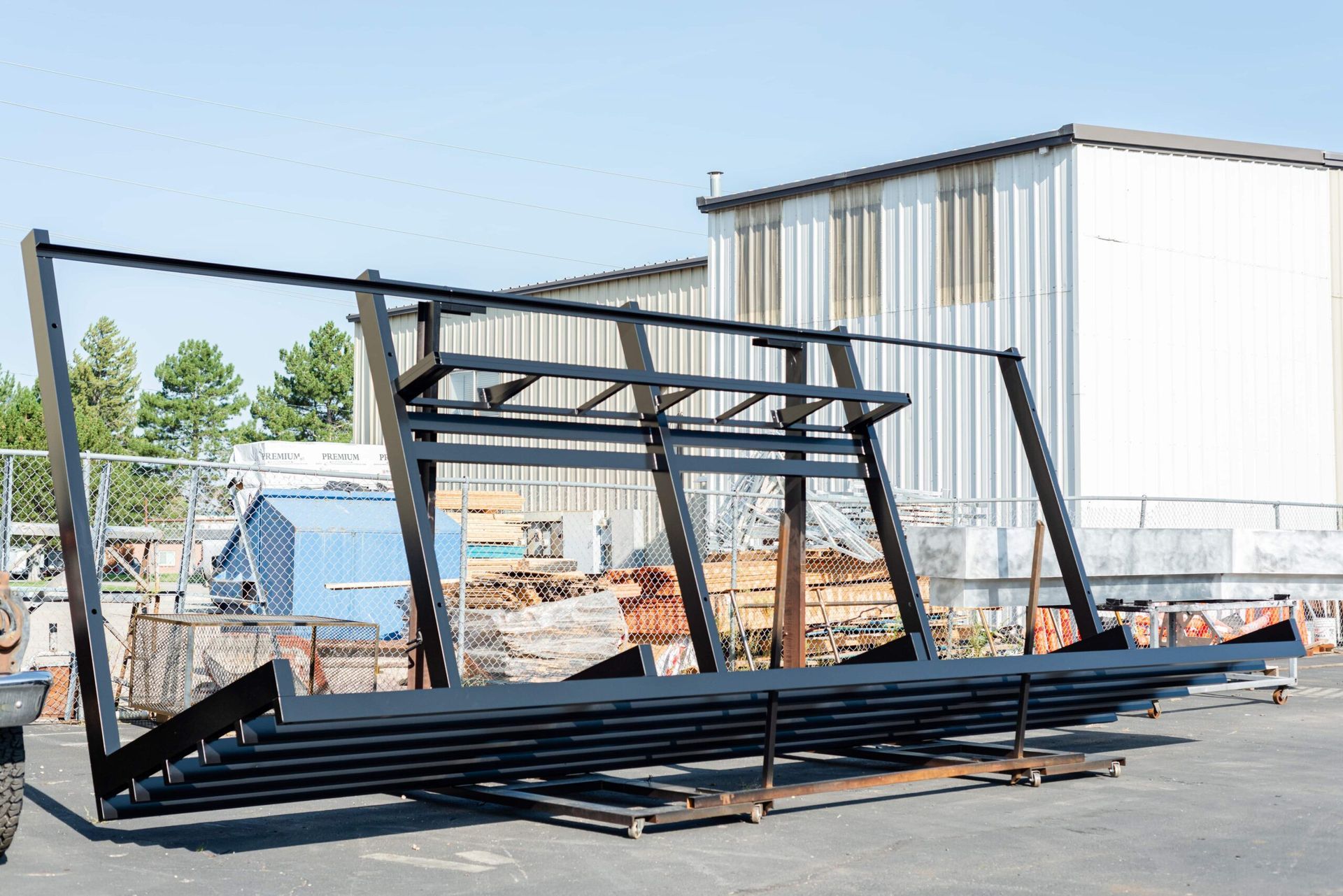 A large metal structure is sitting in front of a building