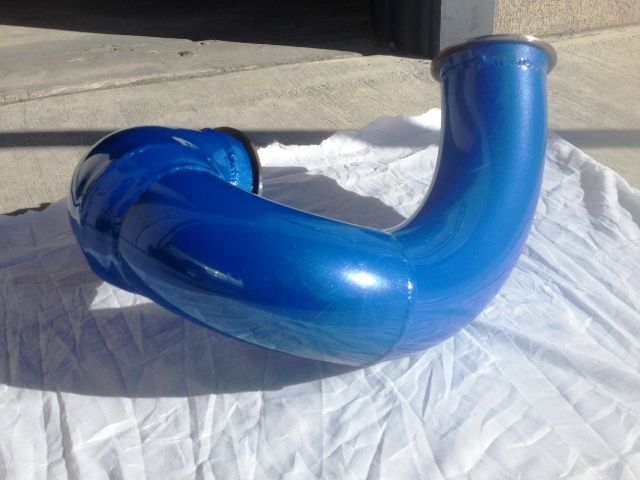A blue pipe is sitting on a white cloth