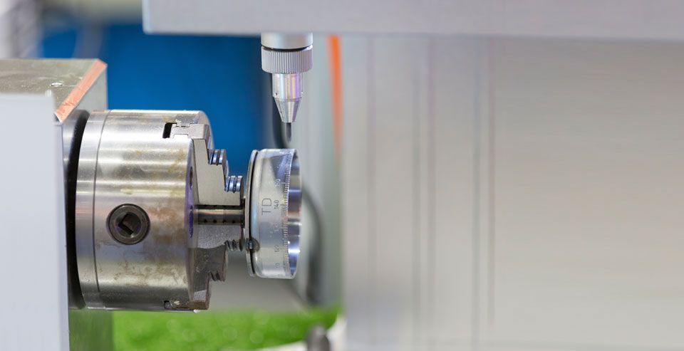 A close up of a machine with a chuck on it.
