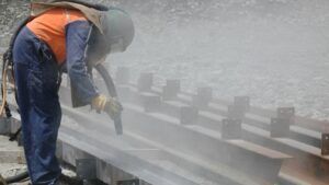 Sandblasting away rust