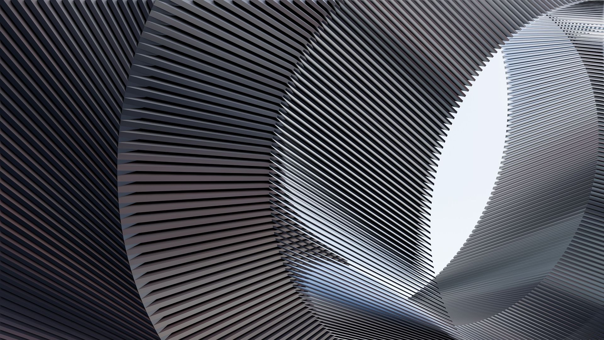 Abstract close-up of a metallic spiral tunnel with gray and blue reflections