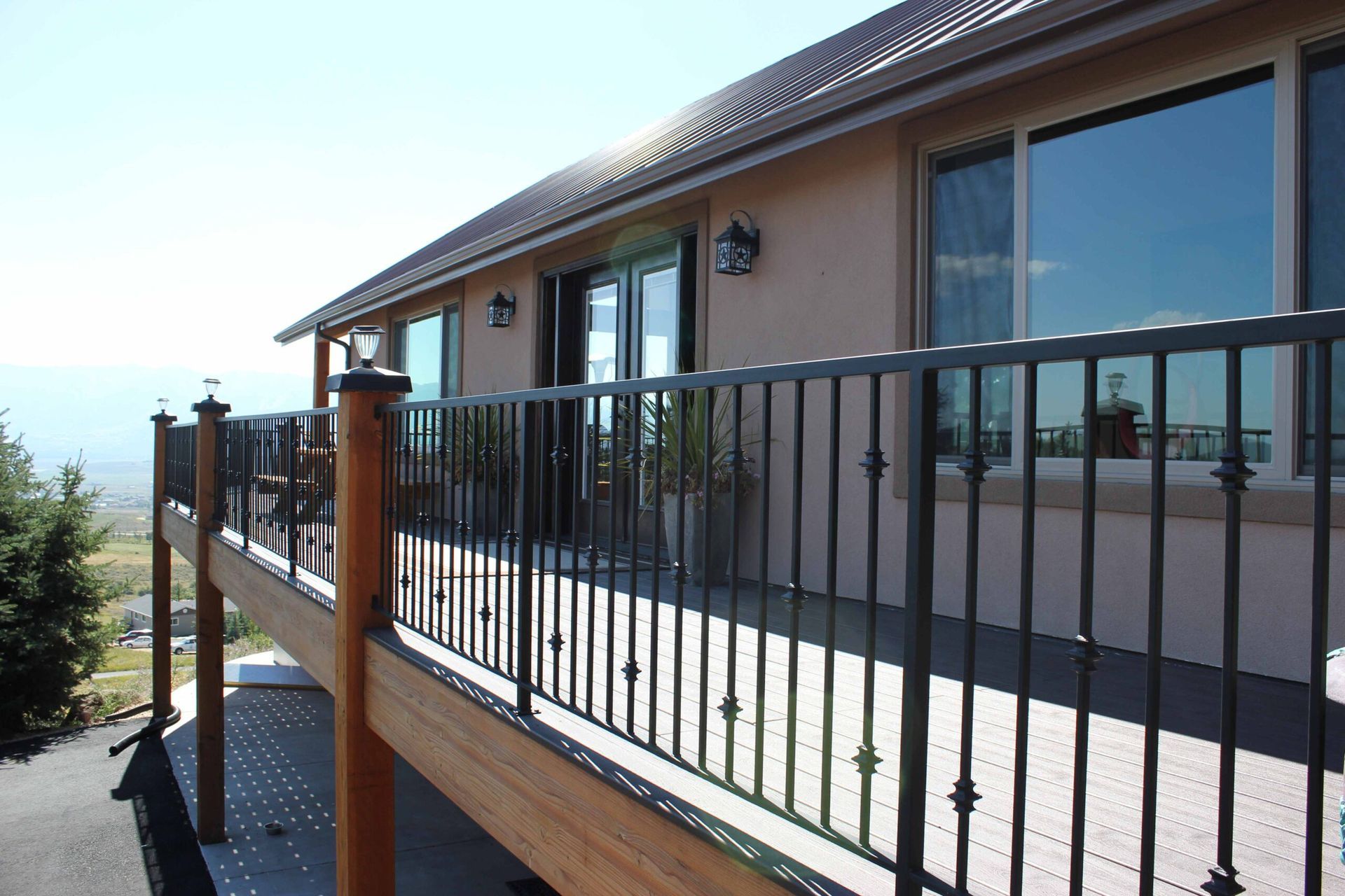 A house with a balcony and a wrought iron railing