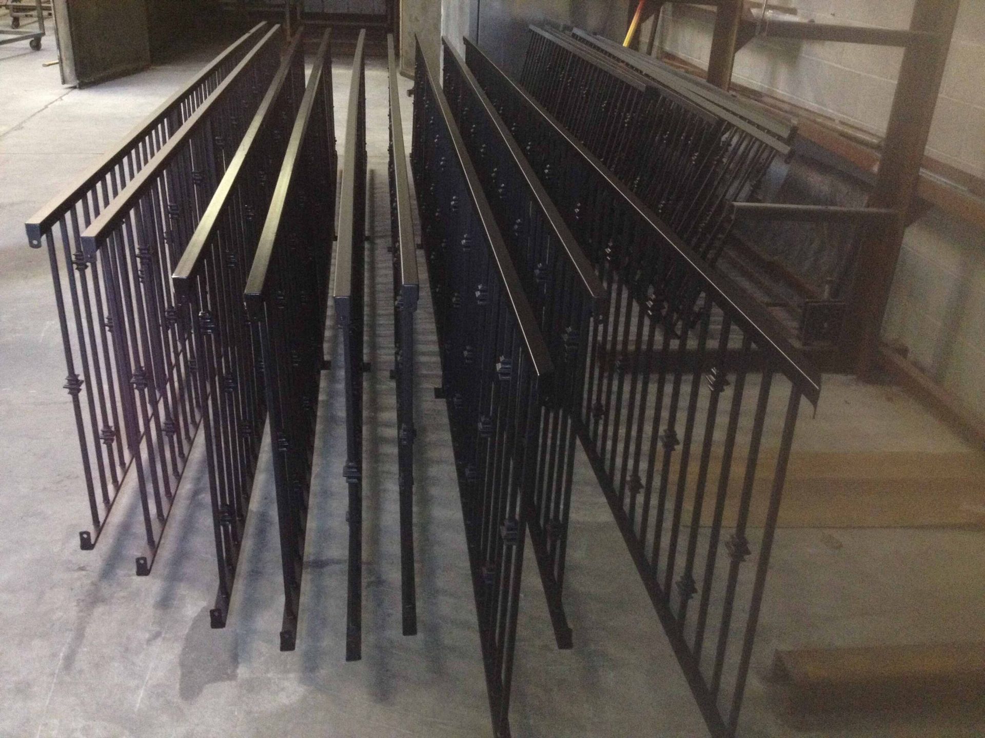 A bunch of metal fences are stacked on top of each other