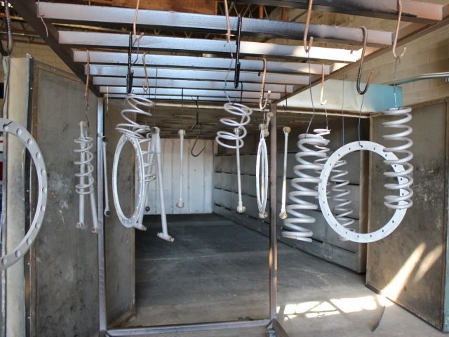A bunch of metal rings hanging from the ceiling