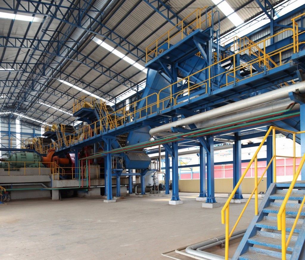 A large warehouse with stairs leading up to it