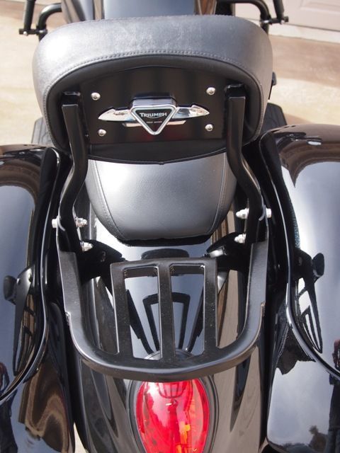 A black motorcycle with the word victory on the back