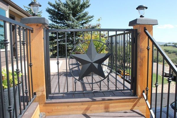 A wrought iron gate with a black star on it