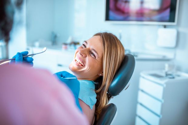 Woman Smiling At Her Dentist — Flanders, NJ — David M Book, DMD