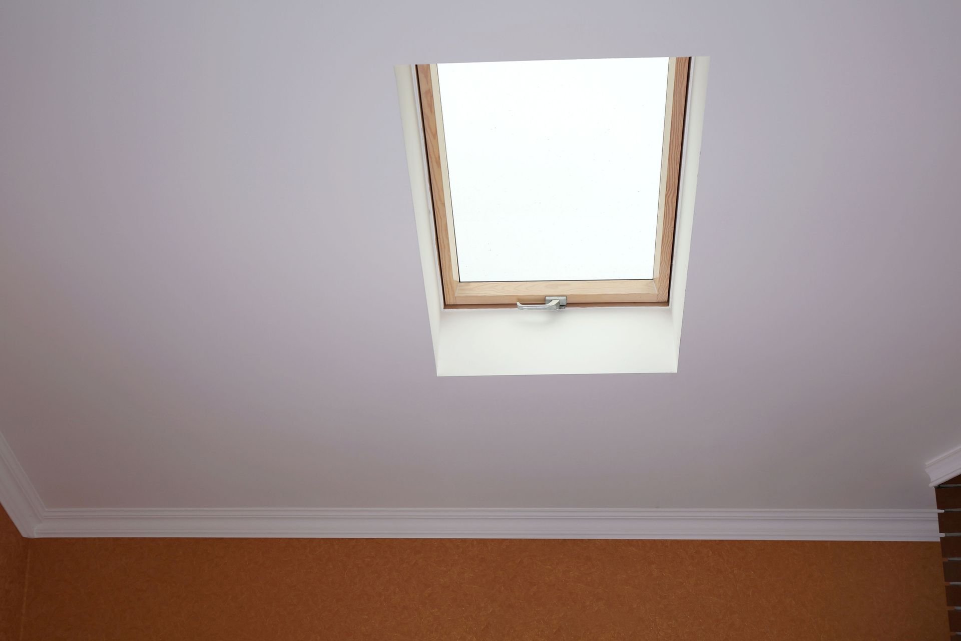 a white ceiling with a skylight in it
