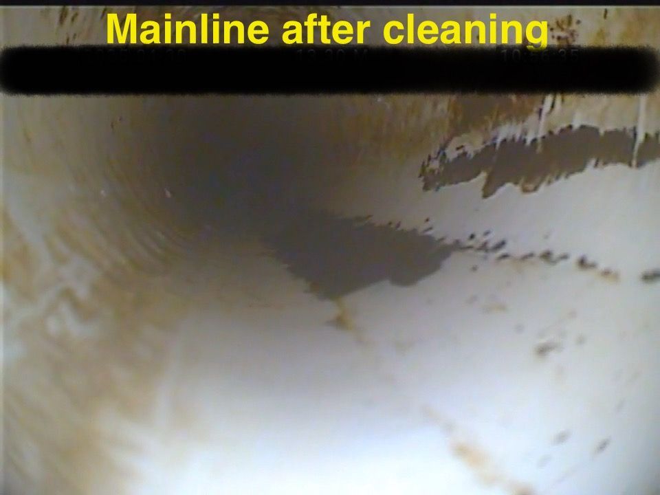 A picture of a dirty wall with the words `` mainline after cleaning '' written on it.
