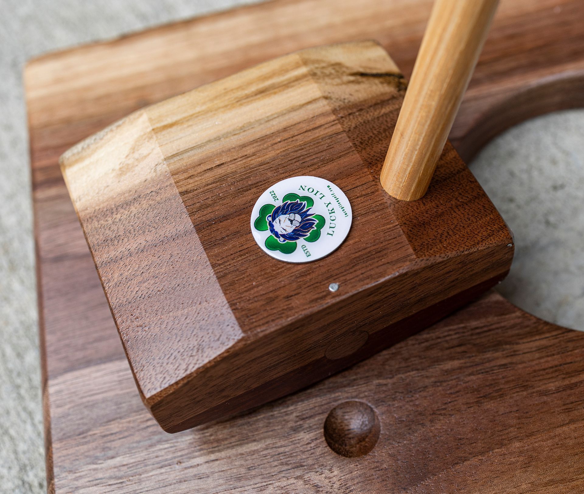A wooden block with a flower on it