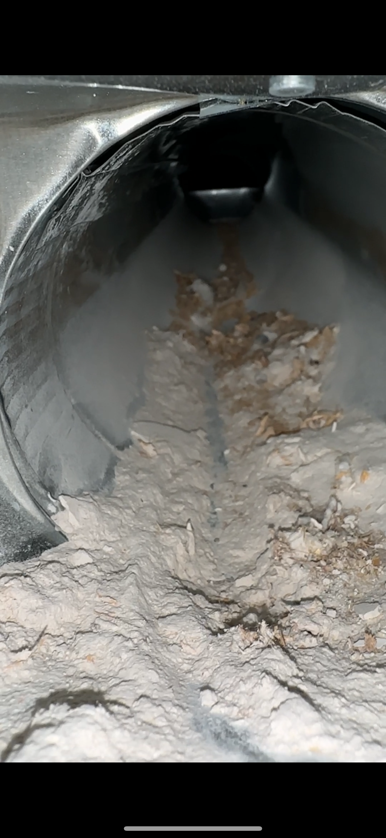 A close up of a dirty sink with a hole in it.