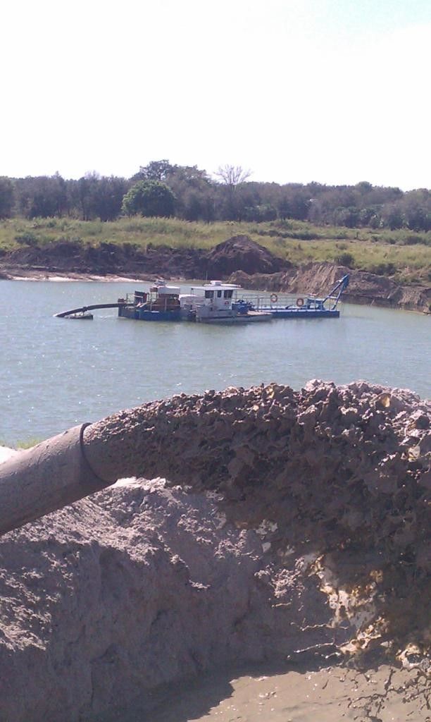 Dredging Harbor With Excavator — Rockledge, FL — Central Sand Inc.