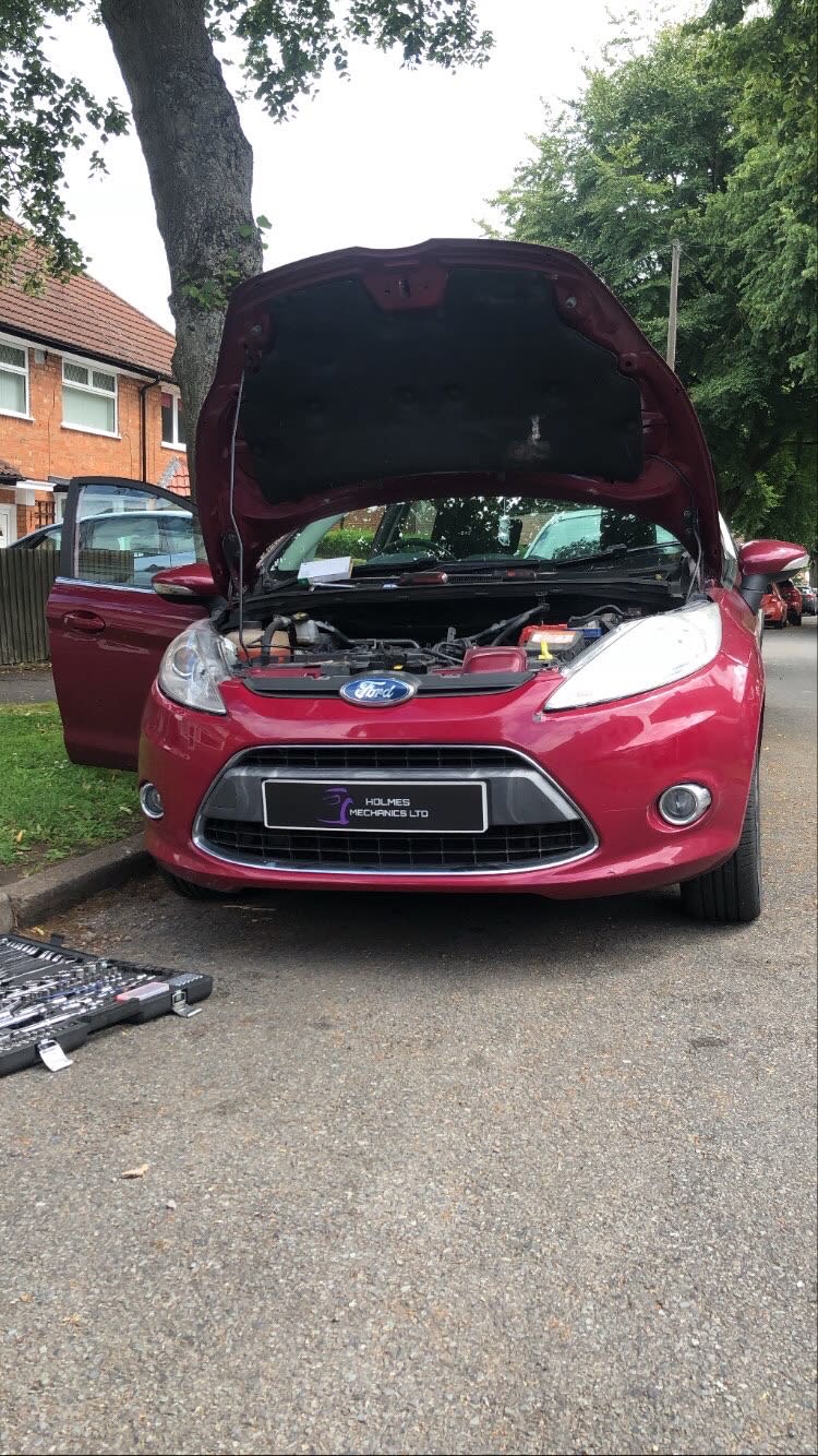 red car bonnet up car door open