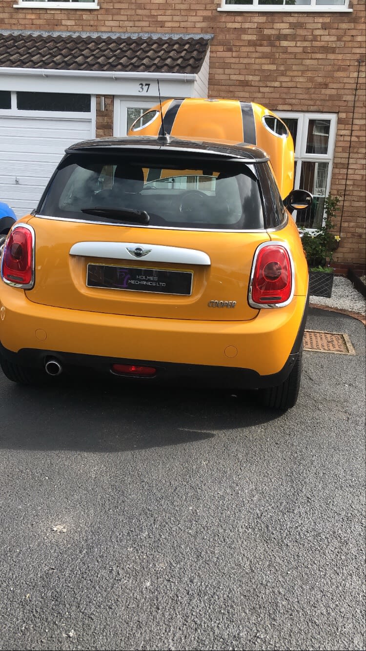 yellow car bonnet open