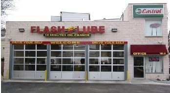 A person is pouring oil into a car engine.