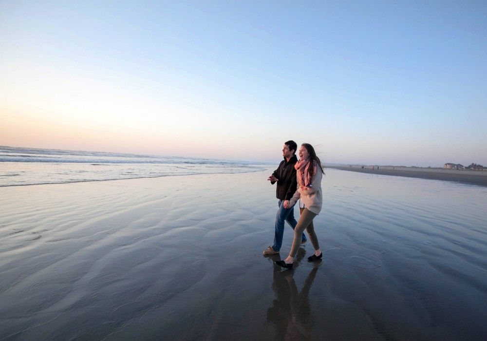 People walking along the beach