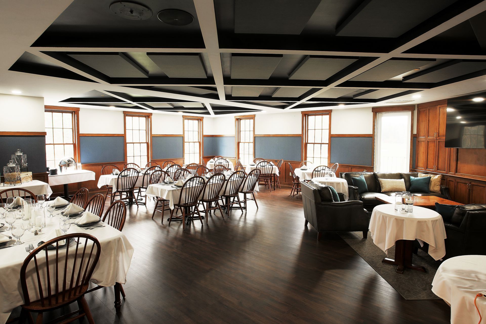 A large room with tables and chairs in it