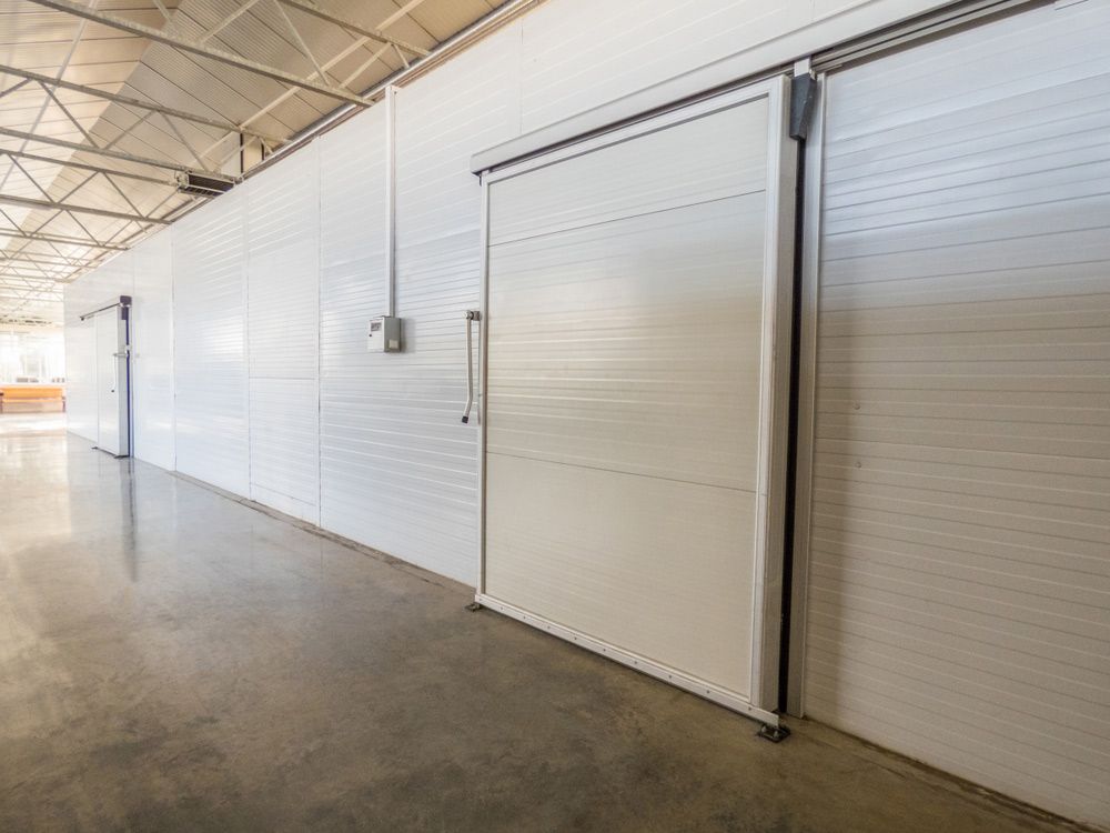 A Long Hallway With Sliding Doors In A Warehouse — EasyLock Storage In Southport, QLD