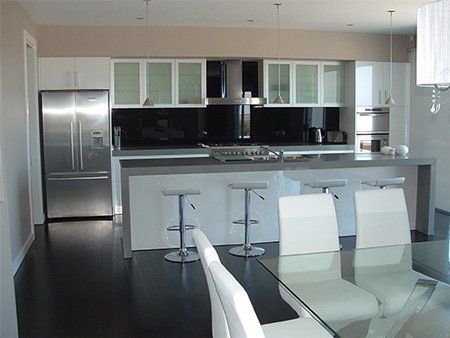 nice modern kitchen with white chairs