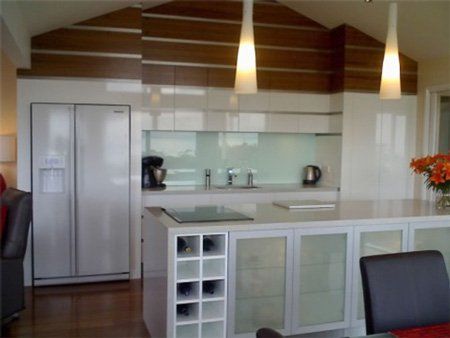 modern kitchen with glass splashback