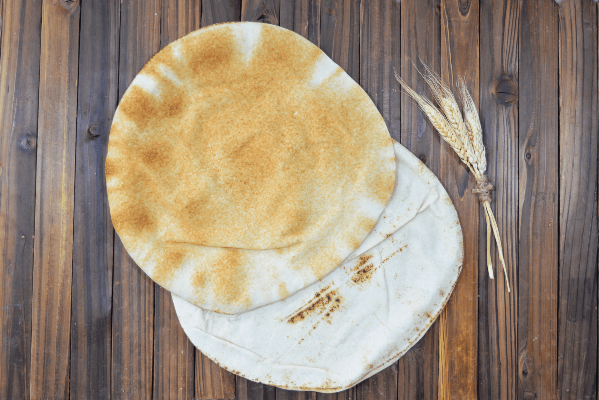 Wooden background with Arabic Pita Bread