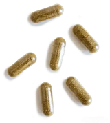 Six green-brown capsules scattered on a white surface.