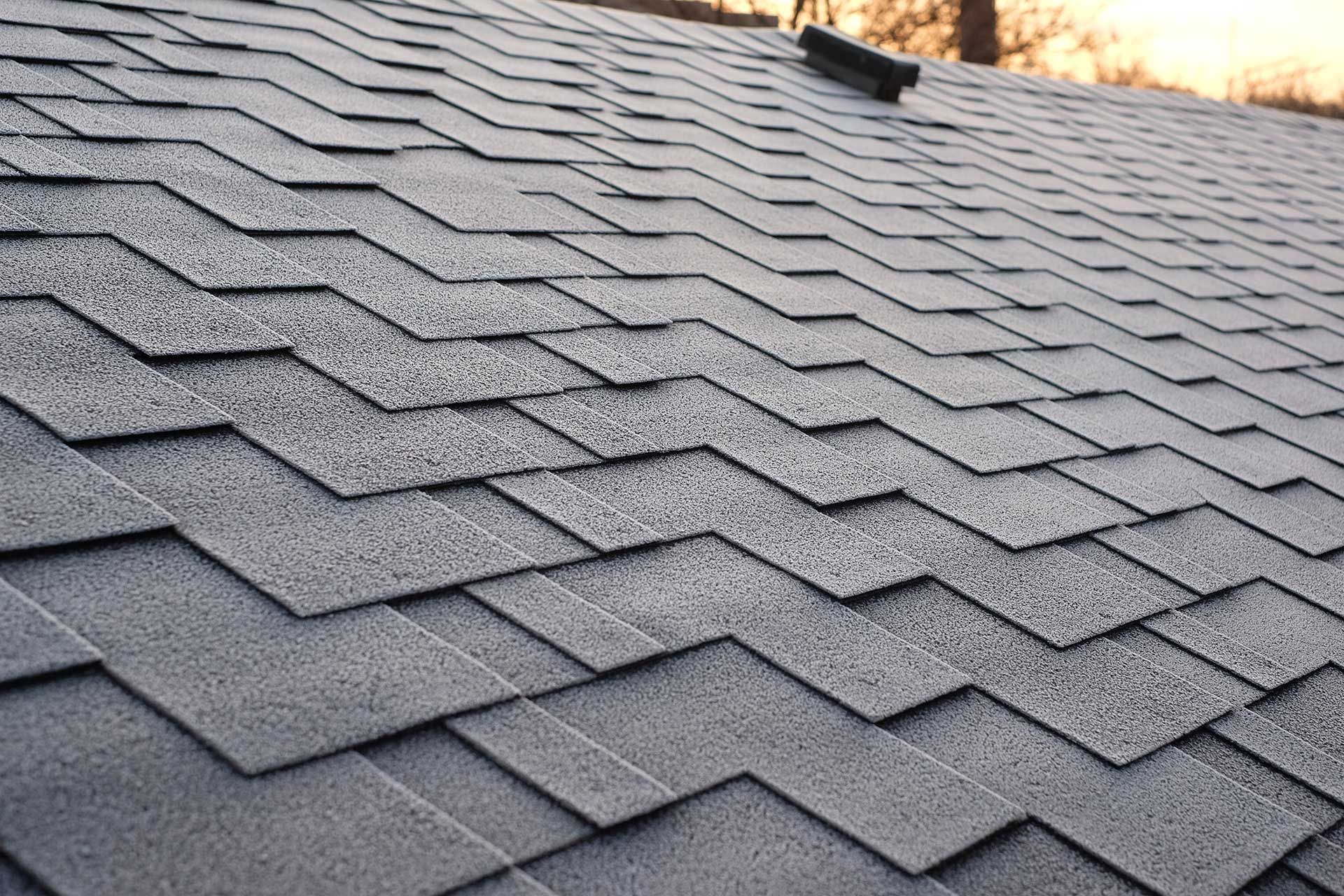 Close up view on Asphalt Roofing Shingles Background.