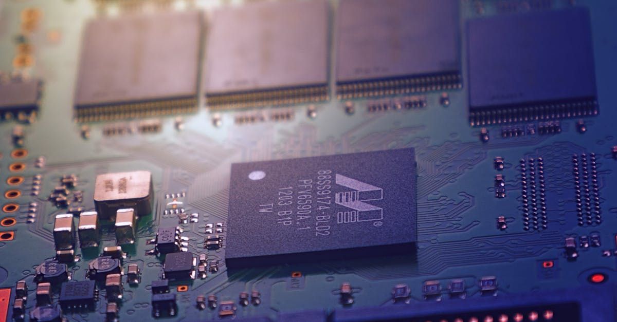 A close up of a motherboard with a chip on it.