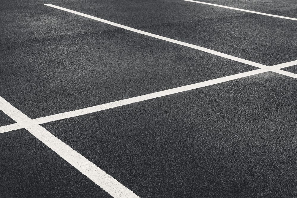 A Black and White Photo of a Parking Lot With White Lines — North Coast Line Marking in Brunswick Heads, NSW