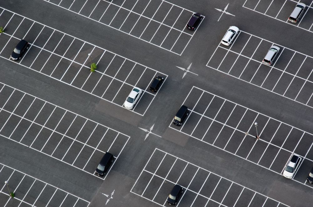 An Aerial View of a Parking Lot With Cars Parked in Rows — North Coast Line Marking in Tweed Heads, NSW