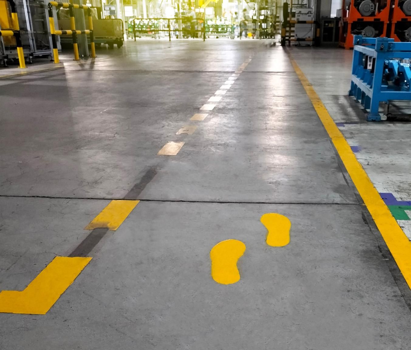 Yellow Footprints Are Painted on the Floor of a Warehouse — North Coast Line Marking in Talofa, NSW