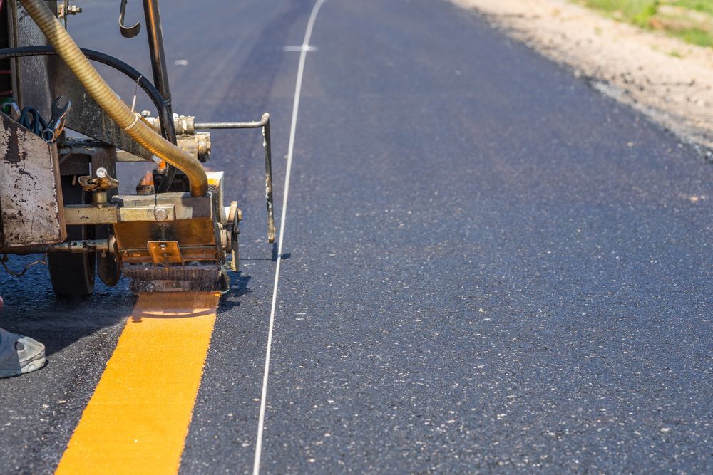 A Machine is Painting a Yellow Line on the Road — North Coast Line Marking in Coffs Harbour, NSW