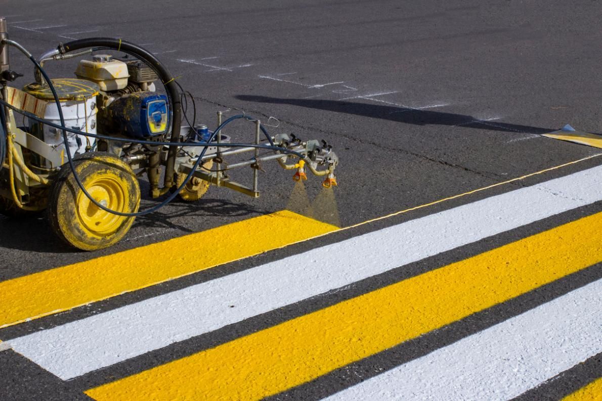 A Machine is Spraying Yellow Paint on a Crosswalk — North Coast Line Marking in Murwillumbah, NSW