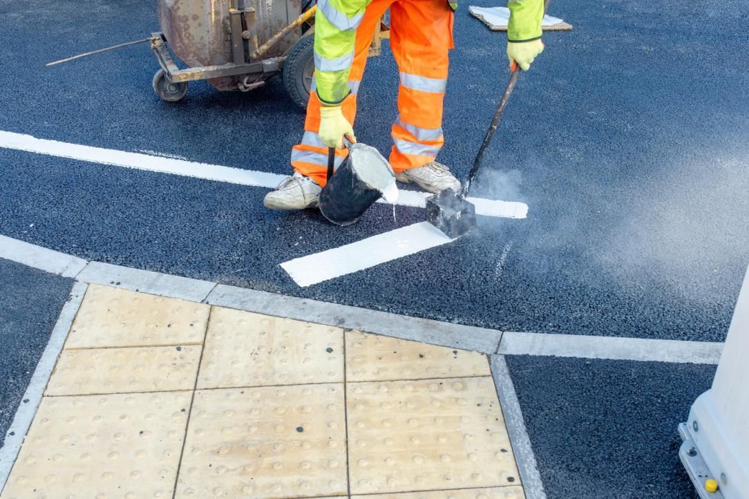 A Man is Painting White Lines on the Road — North Coast Line Marking in Ballina, NSW