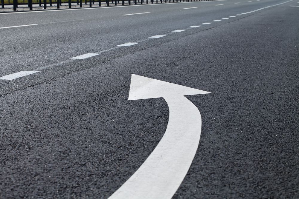 A White Arrow is Painted on the Side of a Road — North Coast Line Marking in Talofa, NSW