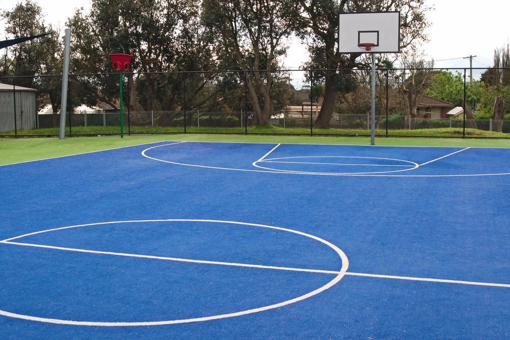 A Blue Basketball Court With White Lines and a Basketball Hoop — North Coast Line Marking in Yamba, NSW