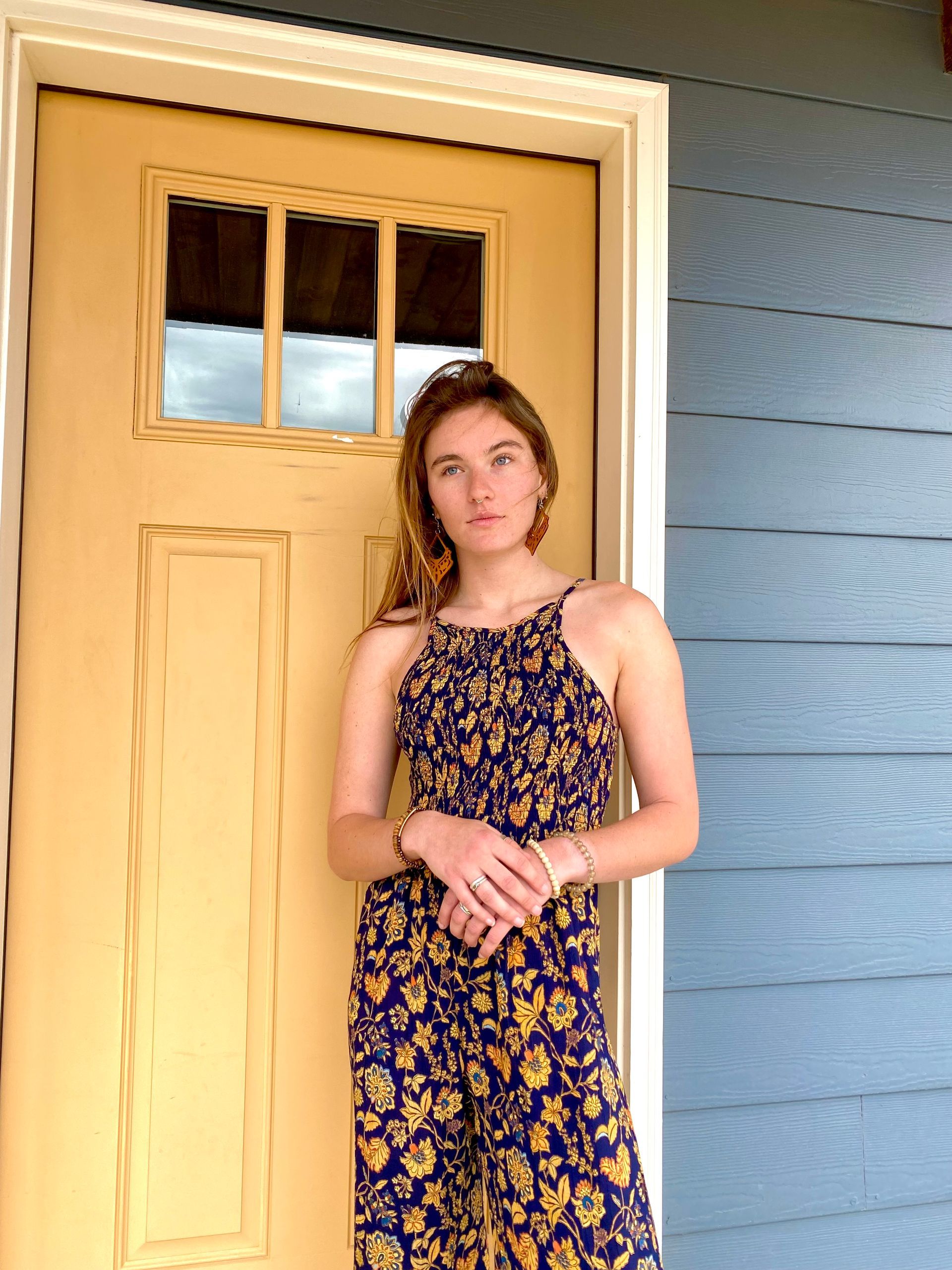 A store filled with lots of clothes and a mannequin.