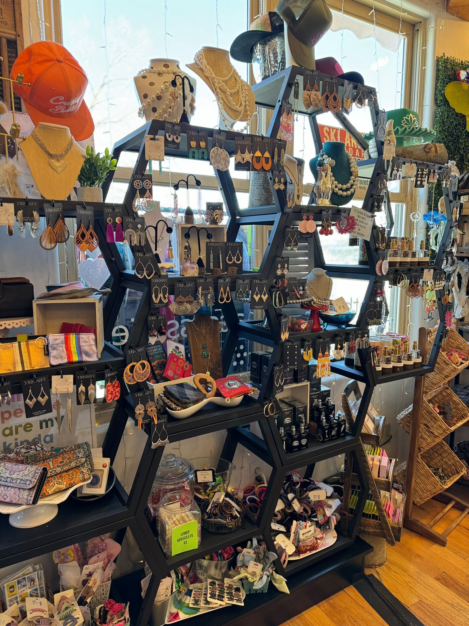 A store filled with lots of jewelry and hats.