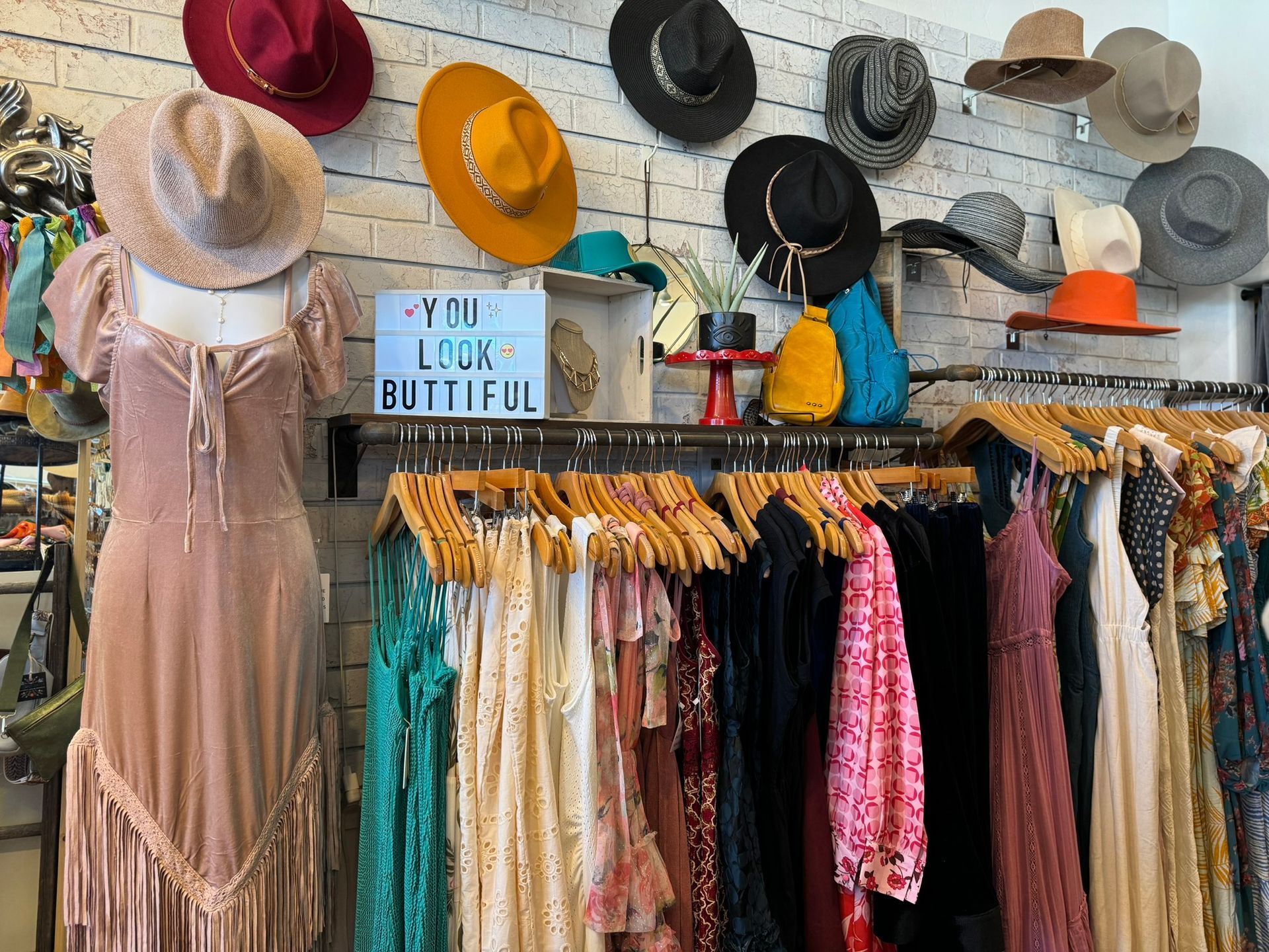 A store filled with lots of clothes and hats.