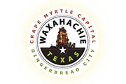 Waxahachie, Texas city seal with a black and white bridge over a red ring and “Grape Myrtle Capital” and “Gingerbread City” text