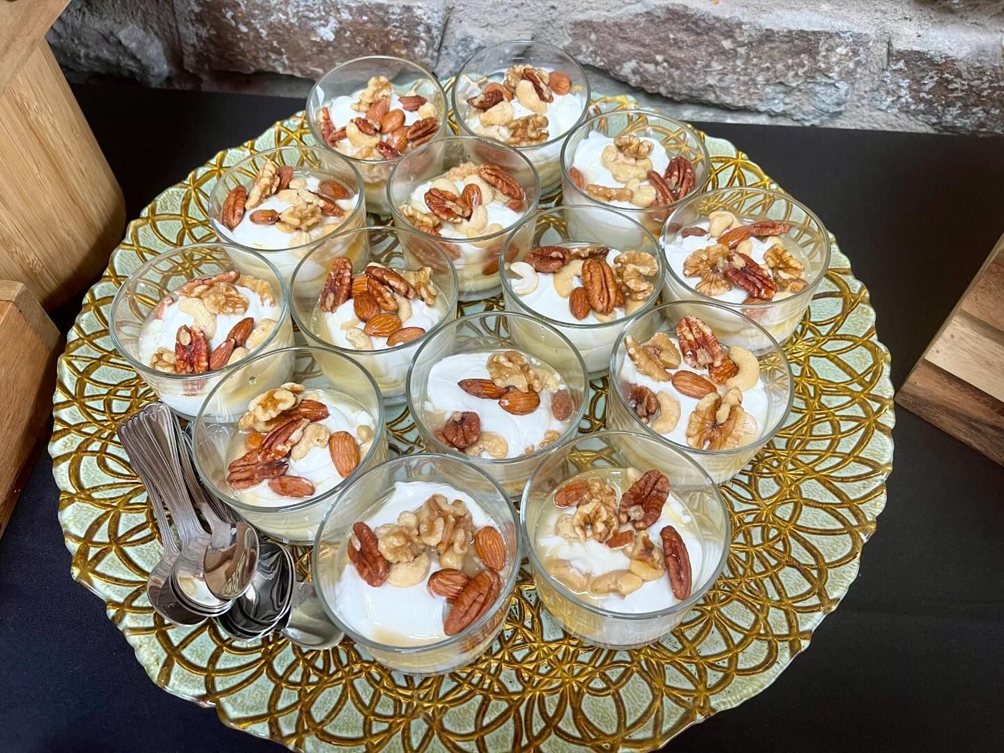 A plate of desserts with nuts on top of them on a table.