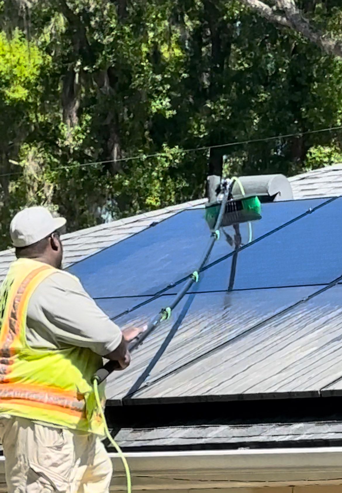 Man cleaning the solar panel