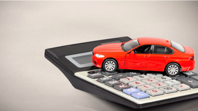 Calculator, fare sheet and luxury car interior to illustrate chauffeur service pricing